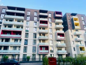 a large apartment building with colorful balconies on it at Joy City Stay Vivalia 7B-26 in Timişoara