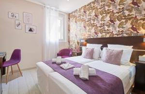 Postel nebo postele na pokoji v ubytování Hotel du Vieux Port