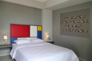 Ένα ή περισσότερα κρεβάτια σε δωμάτιο στο Design Architectonika