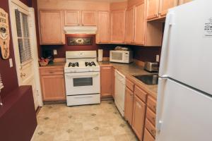 a kitchen with a white stove and a refrigerator at Lawn Lane A - #3382 in Estes Park