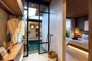 Ένα ή περισσότερα κρεβάτια σε δωμάτιο στο Danu Villas Bali