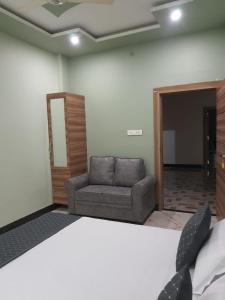Postel nebo postele na pokoji v ubytování Shree Nanda Guest House