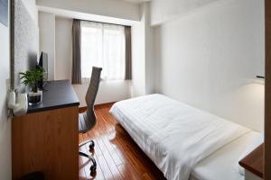 Postel nebo postele na pokoji v ubytování TOKIO's HOTEL