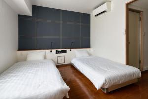 Postel nebo postele na pokoji v ubytování TOKIO's HOTEL