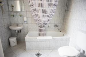 Koupelna v ubytování Hotel Kapos