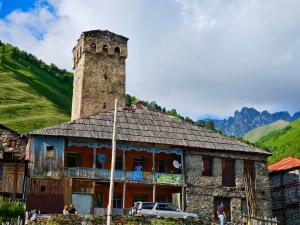 an old building with a tower on top of it at Old House in Adishi