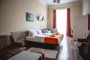 Postel nebo postele na pokoji v ubytování Hotel Kapos