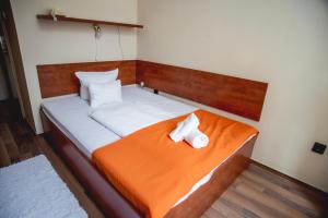 Postel nebo postele na pokoji v ubytování Hotel Kapos