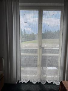 En balkong eller terrasse på Churáňov Stadion