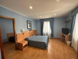 Voodi või voodid majutusasutuse Hotel L'Isola toas