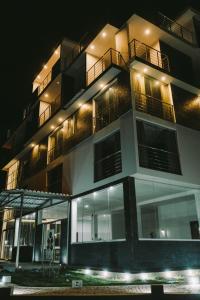 a tall building at night with lights at Redwalls Lodge in Cajamarca