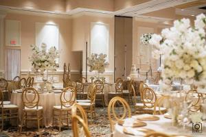 a banquet room with tables and chairs and flowers at Crowne Plaza Executive Center Baton Rouge, an IHG Hotel in Baton Rouge