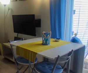 TV a/nebo společenská místnost v ubytování Attico panoramico