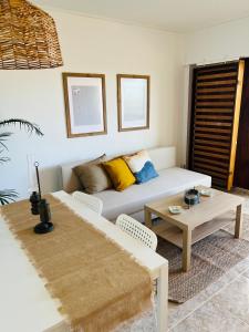 a living room with a couch and a table at Denia Apartamento a 20m de la Playa in Denia