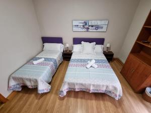 Posteľ alebo postele v izbe v ubytovaní Pension Loinaz