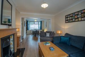 a living room with a couch and a coffee table at Cosy home from home in Bournemouth