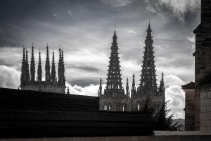 a black and white photo of a cathedral with towers at La Quinta Esencia by Unique Rooms in Burgos