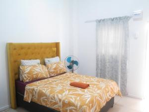 Ένα ή περισσότερα κρεβάτια σε δωμάτιο στο lodgeon91