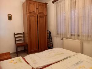 Postel nebo postele na pokoji v ubytování Szilva Apartman