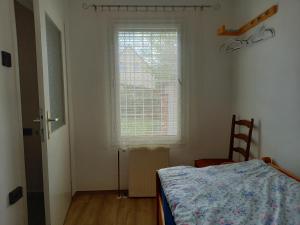 Postel nebo postele na pokoji v ubytování Szilva Apartman