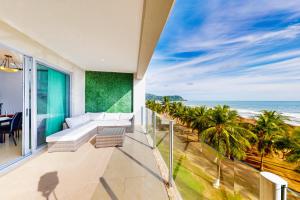 a living room with a view of the ocean at Diamante del Sol, Unit 402N in Jacó