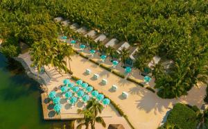 an aerial view of a resort with chairs and umbrellas at Bungalows Key Largo - All Inclusive in Key Largo