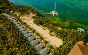 an aerial view of a beach with a boat in the water at Bungalows Key Largo - All Inclusive in Key Largo
