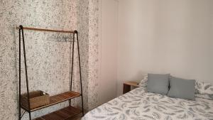 a bedroom with a bed and a swing at Apartamentos las flores in Murcia
