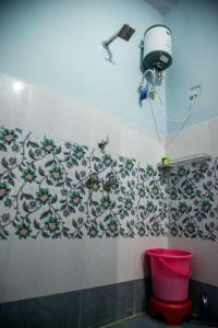 a bathroom with a toilet and a camera on the wall at Little prince guest house & homestay in Bikaner