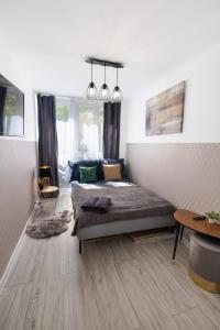 מיטה או מיטות בחדר ב-ClickTheFlat Warsaw Breweries Apart Rooms