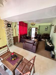 a living room with a couch and a table at Cool Living at GVR Landed Unit in Genting Highlands