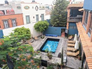 an overhead view of a backyard with a swimming pool at La Joya Azul SMA - LGBTQS in San Miguel de Allende