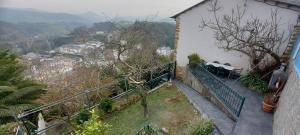 a balcony of a house with a view of a mountain at Villa Mercedes in Luarca