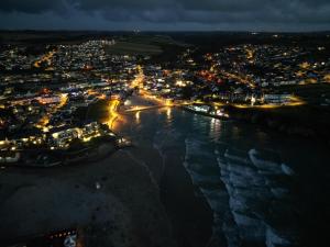 an aerial view of a city at night at Valley View with a luxurious hot tub in Newquay