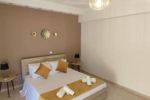 Ένα ή περισσότερα κρεβάτια σε δωμάτιο στο Tilos Pearl