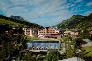 a resort in a valley with mountains in the background at Hotel Austria in Lech am Arlberg