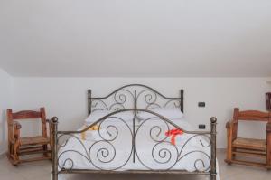 Postel nebo postele na pokoji v ubytování B&B Le Fresie