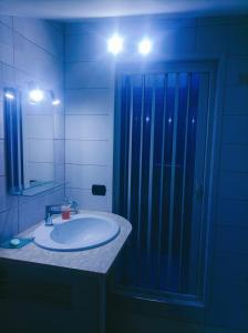 a bathroom with a sink and a shower at Surripe Casa Vacanze in San Lorenzello +34 photos