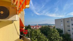 a view of a balcony with flowers on a building at LOVEly Home&Lake in Balatonfüred