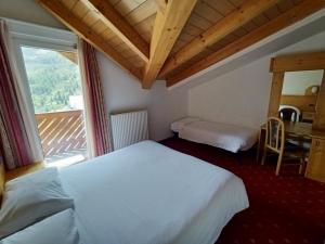 Postel nebo postele na pokoji v ubytování Hotel Cielo Blú