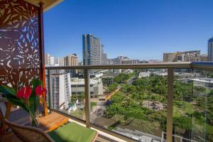 a balcony with a view of a city at Studio with gorgeous views tastefully furnished L1514 in Honolulu