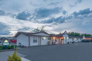 a house with a parking lot in front of it at Days Inn by Wyndham Jamestown in Jamestown