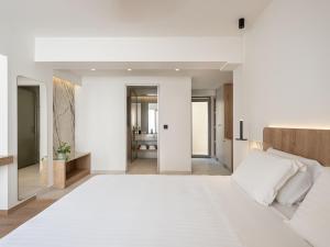 Posteľ alebo postele v izbe v ubytovaní Iperion Beach Hotel