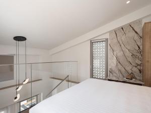 Posteľ alebo postele v izbe v ubytovaní Iperion Beach Hotel