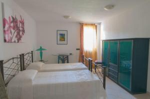 Postel nebo postele na pokoji v ubytování B&B Le Fresie