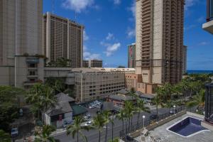 a view of a city with palm trees and buildings at Waikiki Boutique studio GREAT location PW514 in Honolulu
