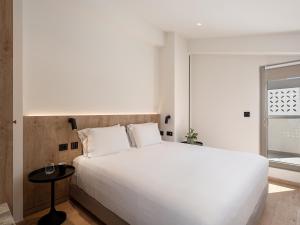 Posteľ alebo postele v izbe v ubytovaní Iperion Beach Hotel