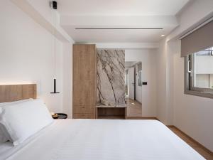 Posteľ alebo postele v izbe v ubytovaní Iperion Beach Hotel