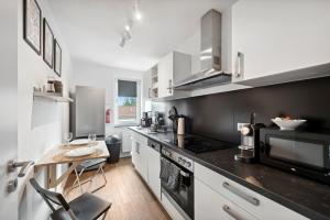 Kuchyň nebo kuchyňský kout v ubytování Amalfi Apartments A01 - gemütliche 2 Zi-Wohnung mit Boxspringbetten und smart TV
