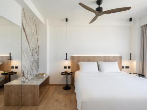 Posteľ alebo postele v izbe v ubytovaní Iperion Beach Hotel